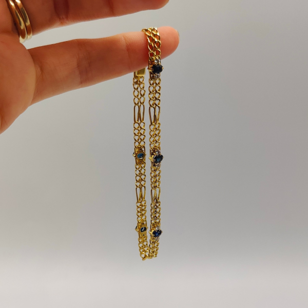 Pulsera doble fígaro unidas por un zafiros y diamantes