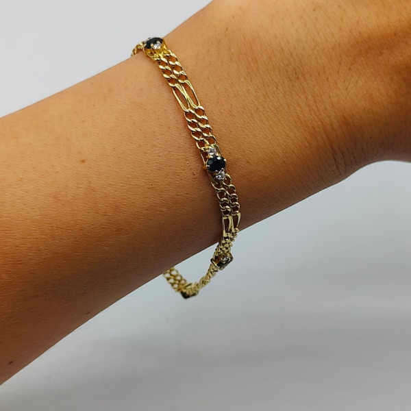 Pulsera doble fígaro unidas por un zafiros y diamantes