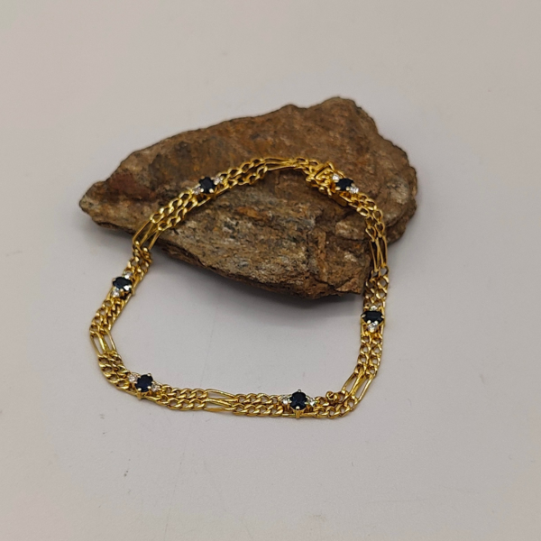 Pulsera doble fígaro unidas por un zafiros y diamantes