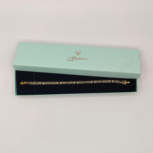 Pulsera doble fígaro unidas por un zafiros y diamantes