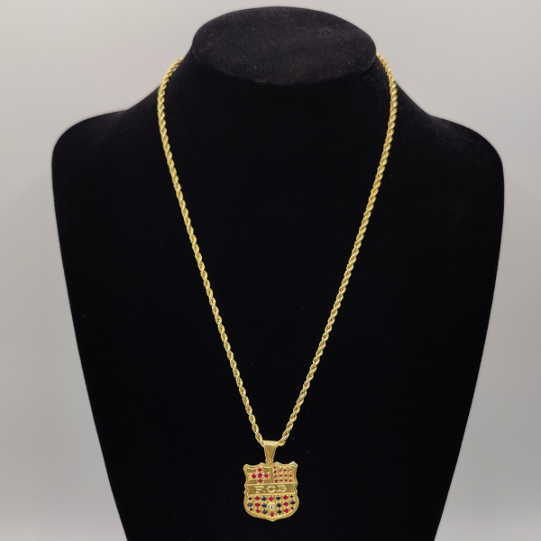 Colgante del barça con diamante en medio y rbís y zafiros combinados para crear los colores del barça oro de 18 k REF:CG15