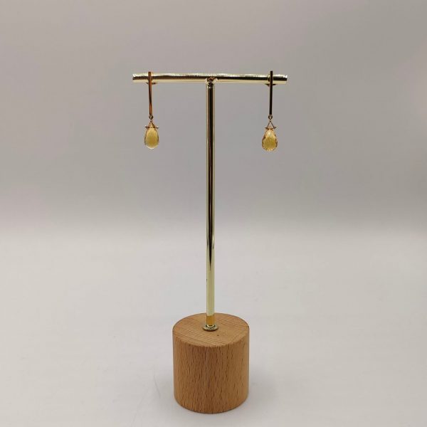 Pendientes colgados con circonita naranja en forma de gota y oro de 18k
