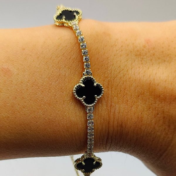 Pulsera de plata estilo riviera con 3 flores önix