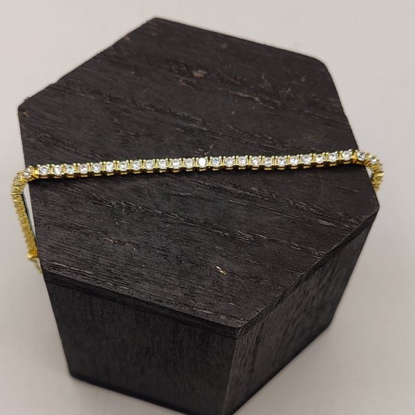 Pulsera de plata chapada en oro riviera con circonitas blanas