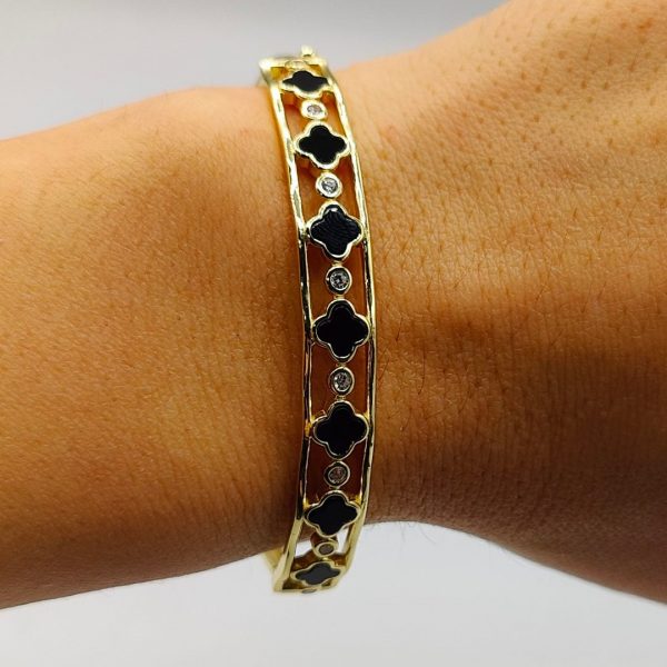 Brazalete flores van cleff en negro intercaladas con circonitas