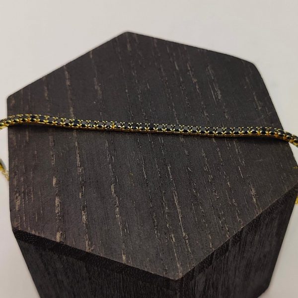 Pulsera de plata chapada en oro riviera con circonitas negras