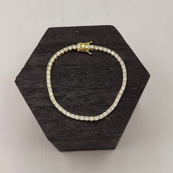 Pulsera de plata chapada en oro riviera con circonitas blanas