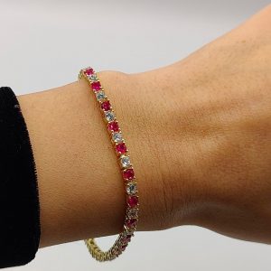 Pulsera de Plata Chapada en Oro Estilo Riviera con Circonitas Fucsias y Blancas