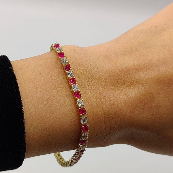 Pulsera de Plata Chapada en Oro Estilo Riviera con Circonitas Fucsias y Blancas
