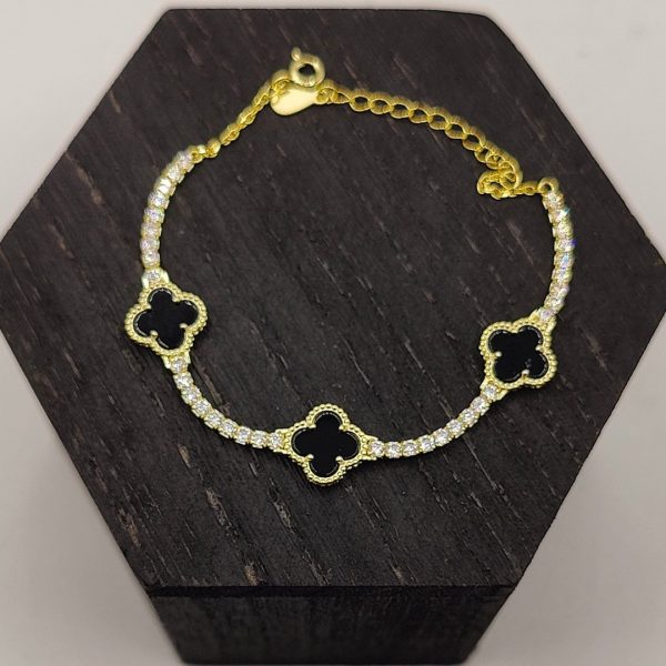 Pulsera de plata estilo riviera con 3 flores önix