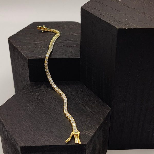 Pulsera de plata chapada en oro riviera con circonitas blanas