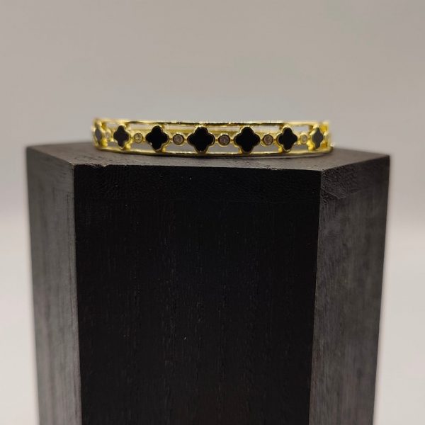 Brazalete flores van cleff en negro intercaladas con circonitas