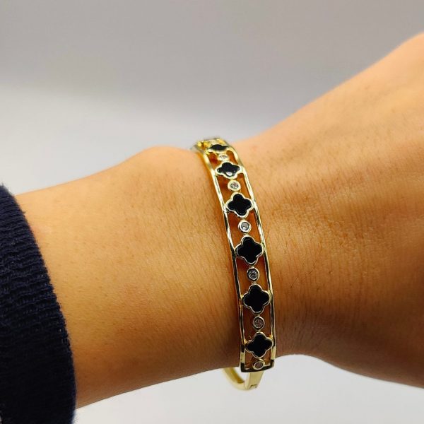 Brazalete flores van cleff en negro intercaladas con circonitas