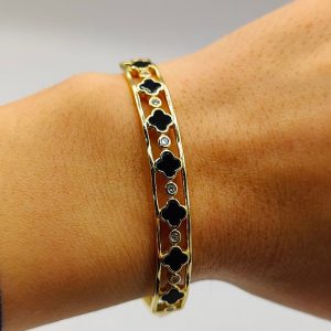 Brazalete flores van cleff en negro intercaladas con circonitas