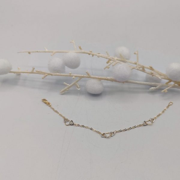 Pulsera Rolo con Corazones Entrelazados de Oro Dorado y Blanco – 18K