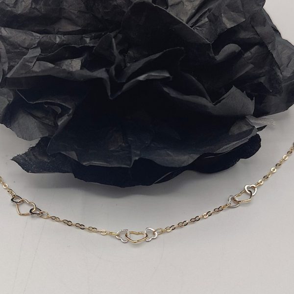 Pulsera Rolo con Corazones Entrelazados de Oro Dorado y Blanco – 18K