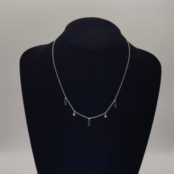 Collar con charms de bolitas y de infinitos con cdena rolo de plata