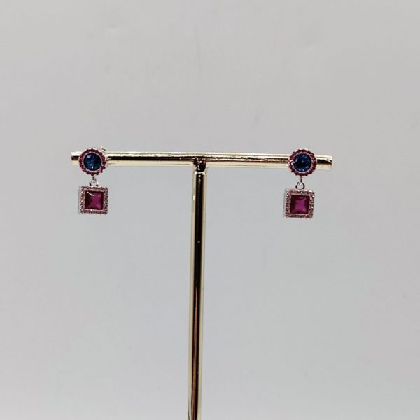 Pendientes colgantes de plata dorada con circonitas azul noche y rosas