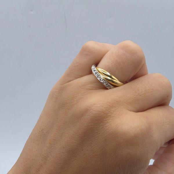 Anillo Triple Entrelazado en Oro 18K con Circonitas
