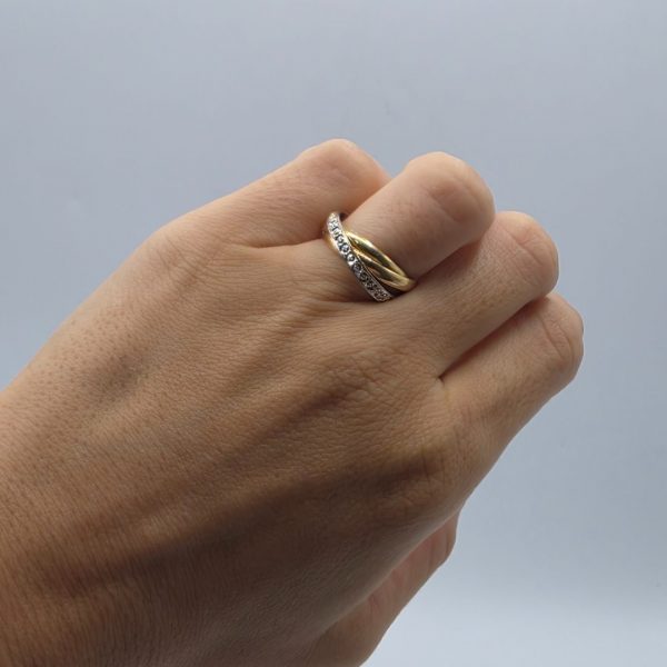Anillo Triple Entrelazado en Oro 18K con Circonitas